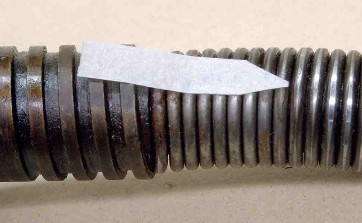 The shiny spot shows where this mainspring is rubbing hard on the inside of the bolt body. Mainspring rubbing can be easily felt when the striker assembly is pushed into the bolt.